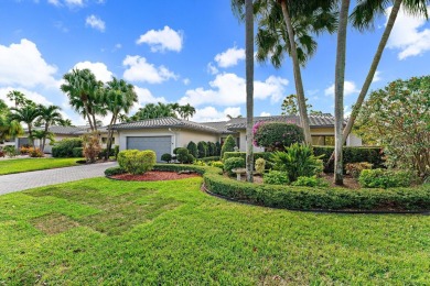 Enjoy golf and water views from this charming one-story on Delray Dunes Golf and Country Club in Florida - for sale on GolfHomes.com, golf home, golf lot