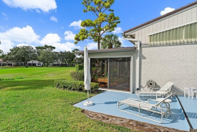 Enjoy golf and water views from this charming one-story on Delray Dunes Golf and Country Club in Florida - for sale on GolfHomes.com, golf home, golf lot