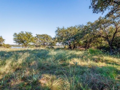 Build your lakeside retreat on this elevated 0.3-acre lot within on Hideout Golf Club and Resort  in Texas - for sale on GolfHomes.com, golf home, golf lot