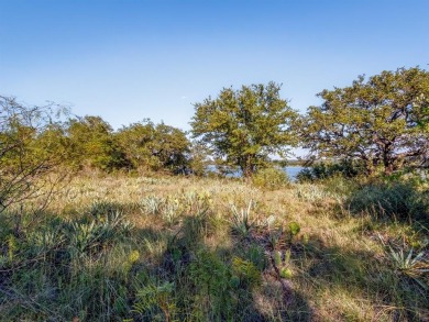 Build your lakeside retreat on this elevated 0.3-acre lot within on Hideout Golf Club and Resort  in Texas - for sale on GolfHomes.com, golf home, golf lot