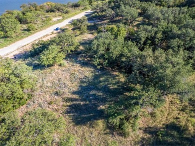 Build your lakeside retreat on this elevated 0.3-acre lot within on Hideout Golf Club and Resort  in Texas - for sale on GolfHomes.com, golf home, golf lot