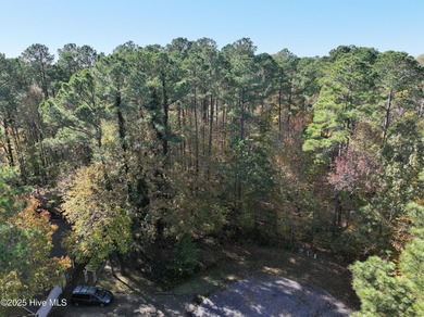 Lot is .56 acres wooded in a private location at the end of on Sound Golf Links at Albemarle Plantation in North Carolina - for sale on GolfHomes.com, golf home, golf lot