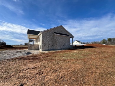 Nestled in the heart of Willow Estates, this stunning new brick on Southern Hills Golf and Country Club in Tennessee - for sale on GolfHomes.com, golf home, golf lot