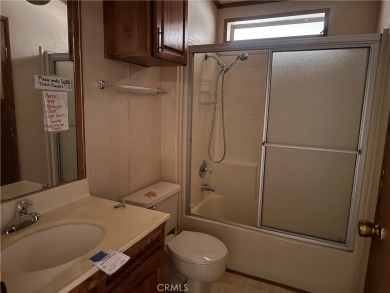 Welcome to this spacious 2-bedroom, 2-bath mobile home offering on The Club At Shenandoah Springs in California - for sale on GolfHomes.com, golf home, golf lot