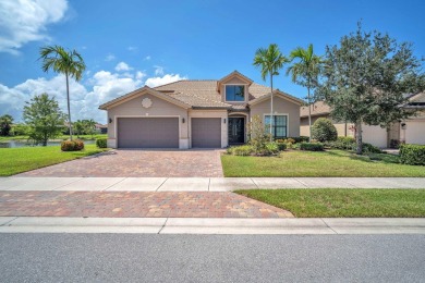 This stunning waterfront home, situated on a rare, ultra-premium on Jupiter Country Club in Florida - for sale on GolfHomes.com, golf home, golf lot