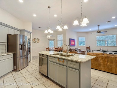 Fall in love with this picturesque Golf Course View heated pool on Citrus Hills Golf Club in Florida - for sale on GolfHomes.com, golf home, golf lot
