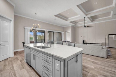 This stunning waterfront home, situated on a rare, ultra-premium on Jupiter Country Club in Florida - for sale on GolfHomes.com, golf home, golf lot