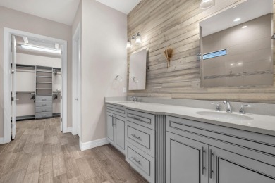 This stunning waterfront home, situated on a rare, ultra-premium on Jupiter Country Club in Florida - for sale on GolfHomes.com, golf home, golf lot