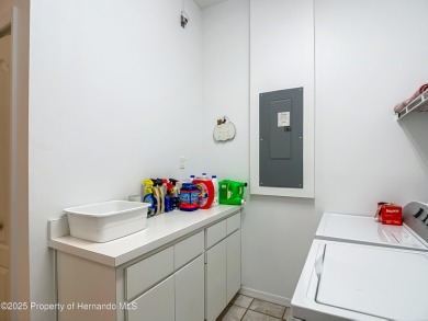 Fall in love with this picturesque Golf Course View heated pool on Citrus Hills Golf Club in Florida - for sale on GolfHomes.com, golf home, golf lot