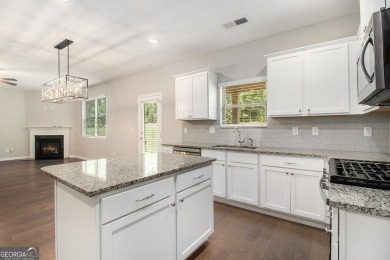 Welcome to refined living in the prestigious, gated community of on Canongate At Heron Bay in Georgia - for sale on GolfHomes.com, golf home, golf lot
