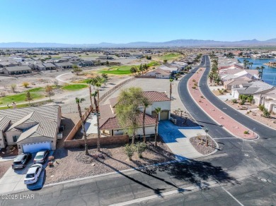This spacious 2-story custom pool home in the gated Los Lagos on Los Lagos Golf Club in Arizona - for sale on GolfHomes.com, golf home, golf lot