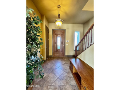This spacious 2-story custom pool home in the gated Los Lagos on Los Lagos Golf Club in Arizona - for sale on GolfHomes.com, golf home, golf lot