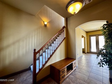 This spacious 2-story custom pool home in the gated Los Lagos on Los Lagos Golf Club in Arizona - for sale on GolfHomes.com, golf home, golf lot
