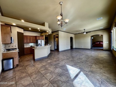 This spacious 2-story custom pool home in the gated Los Lagos on Los Lagos Golf Club in Arizona - for sale on GolfHomes.com, golf home, golf lot