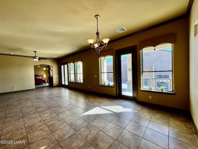 This spacious 2-story custom pool home in the gated Los Lagos on Los Lagos Golf Club in Arizona - for sale on GolfHomes.com, golf home, golf lot