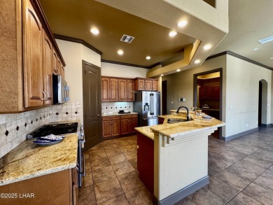 This spacious 2-story custom pool home in the gated Los Lagos on Los Lagos Golf Club in Arizona - for sale on GolfHomes.com, golf home, golf lot