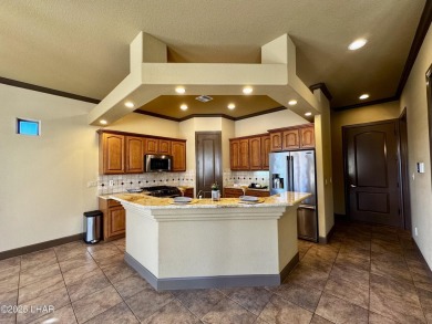 This spacious 2-story custom pool home in the gated Los Lagos on Los Lagos Golf Club in Arizona - for sale on GolfHomes.com, golf home, golf lot