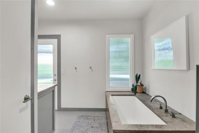 A one-of-a-kind, light-filled home with gorgeous grounds that on Squaw Creek Golf Club in Texas - for sale on GolfHomes.com, golf home, golf lot