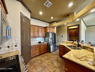 This spacious 2-story custom pool home in the gated Los Lagos on Los Lagos Golf Club in Arizona - for sale on GolfHomes.com, golf home, golf lot