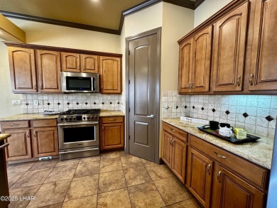 This spacious 2-story custom pool home in the gated Los Lagos on Los Lagos Golf Club in Arizona - for sale on GolfHomes.com, golf home, golf lot