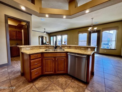 This spacious 2-story custom pool home in the gated Los Lagos on Los Lagos Golf Club in Arizona - for sale on GolfHomes.com, golf home, golf lot