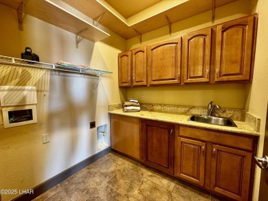 This spacious 2-story custom pool home in the gated Los Lagos on Los Lagos Golf Club in Arizona - for sale on GolfHomes.com, golf home, golf lot