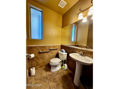 This spacious 2-story custom pool home in the gated Los Lagos on Los Lagos Golf Club in Arizona - for sale on GolfHomes.com, golf home, golf lot