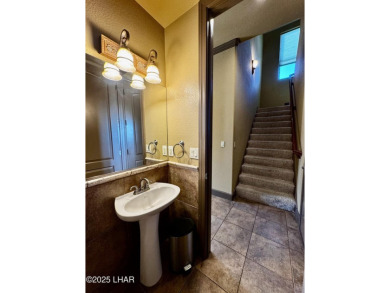 This spacious 2-story custom pool home in the gated Los Lagos on Los Lagos Golf Club in Arizona - for sale on GolfHomes.com, golf home, golf lot