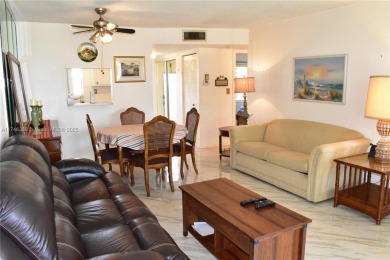 Nice first floor condo with a water view is perfect for those on Sunrise Lakes Phase III in Florida - for sale on GolfHomes.com, golf home, golf lot