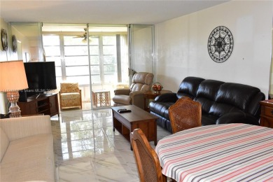 Nice first floor condo with a water view is perfect for those on Sunrise Lakes Phase III in Florida - for sale on GolfHomes.com, golf home, golf lot