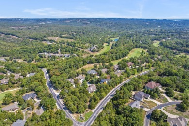 Nestled within the prestigious, gated, golf community of on Ledgestone Country Club and Golf Course in Missouri - for sale on GolfHomes.com, golf home, golf lot