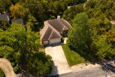 Nestled within the prestigious, gated, golf community of on Ledgestone Country Club and Golf Course in Missouri - for sale on GolfHomes.com, golf home, golf lot