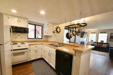 Experience the feeling of living in a treehouse in this bright on The Eagle Pointe Golf Resort in Indiana - for sale on GolfHomes.com, golf home, golf lot