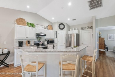 This beautifully updated 2-bedroom, 2-bathroom villa with a on Tampa Bay Golf and Country Club in Florida - for sale on GolfHomes.com, golf home, golf lot