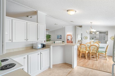 Enjoy easy coastal living in this fully furnished 3-bedroom on Barefoot Bay Golf Course in Florida - for sale on GolfHomes.com, golf home, golf lot