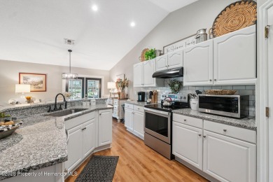This beautifully updated 2-bedroom, 2-bathroom villa with a on Tampa Bay Golf and Country Club in Florida - for sale on GolfHomes.com, golf home, golf lot
