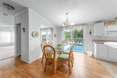 Enjoy easy coastal living in this fully furnished 3-bedroom on Barefoot Bay Golf Course in Florida - for sale on GolfHomes.com, golf home, golf lot