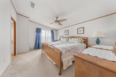 Enjoy easy coastal living in this fully furnished 3-bedroom on Barefoot Bay Golf Course in Florida - for sale on GolfHomes.com, golf home, golf lot