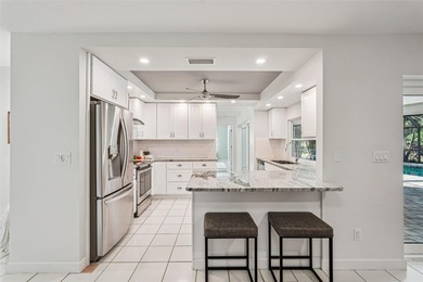 Tasteful three bedroom, two bath residence with heated private on The Meadows Golf and Country Club in Florida - for sale on GolfHomes.com, golf home, golf lot