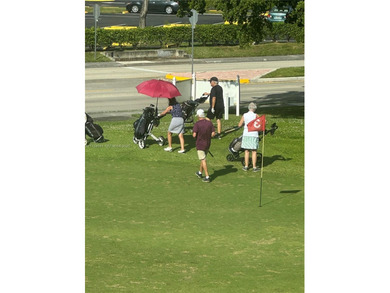 Enjoy watching the golfers on the 3rd hole or participate in the on Sunrise Lakes Phase IV Golf Course in Florida - for sale on GolfHomes.com, golf home, golf lot