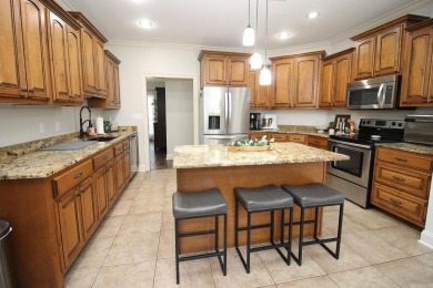 Spacious and elegant 5-bedroom, 3-bath home situated on a on Paragould Country Club in Arkansas - for sale on GolfHomes.com, golf home, golf lot