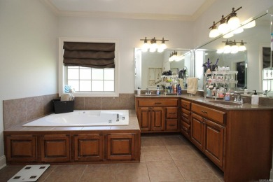 Spacious and elegant 5-bedroom, 3-bath home situated on a on Paragould Country Club in Arkansas - for sale on GolfHomes.com, golf home, golf lot