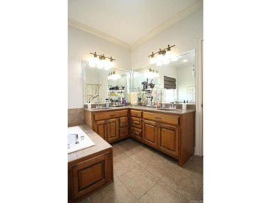 Spacious and elegant 5-bedroom, 3-bath home situated on a on Paragould Country Club in Arkansas - for sale on GolfHomes.com, golf home, golf lot