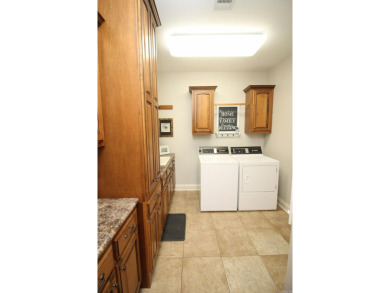 Spacious and elegant 5-bedroom, 3-bath home situated on a on Paragould Country Club in Arkansas - for sale on GolfHomes.com, golf home, golf lot