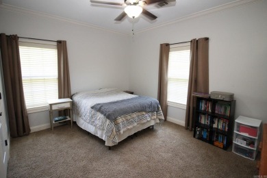Spacious and elegant 5-bedroom, 3-bath home situated on a on Paragould Country Club in Arkansas - for sale on GolfHomes.com, golf home, golf lot