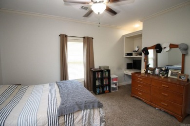 Spacious and elegant 5-bedroom, 3-bath home situated on a on Paragould Country Club in Arkansas - for sale on GolfHomes.com, golf home, golf lot