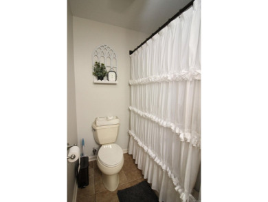Spacious and elegant 5-bedroom, 3-bath home situated on a on Paragould Country Club in Arkansas - for sale on GolfHomes.com, golf home, golf lot
