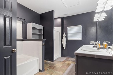 Enjoy this beautifully updated cottage at one of the best golf on The Club At Old Kinderhook in Missouri - for sale on GolfHomes.com, golf home, golf lot