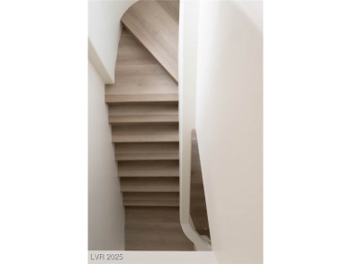 This architectural masterpiece in double guard-gated Spanish on Spanish Trail Golf and Country Club in Nevada - for sale on GolfHomes.com, golf home, golf lot