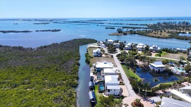Under contract-accepting backup offers. Waterfront lot in the on Coral Creek Club in Florida - for sale on GolfHomes.com, golf home, golf lot
